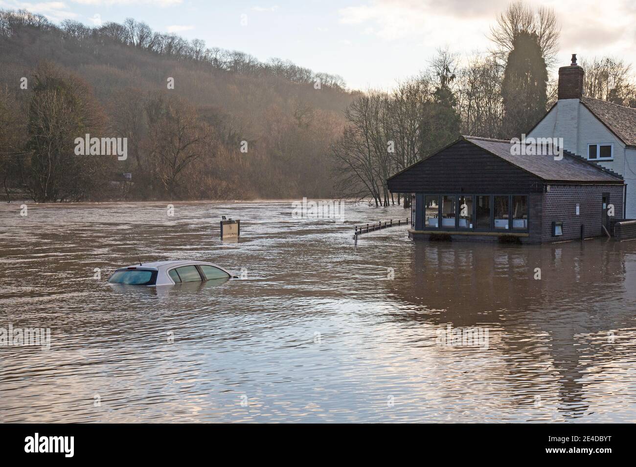 Shropshire, UK. 23rd Jan, 2021. Levels of the River Severn in Shropshire continued to rise overnight, causing sever floods in certain areas. The village of Jackfield in the Ironbridge Gorge World Heritage Site has been particularly badly hit, with homes and businesses badly flooded. Levels are very close to the records floods of February 2020. A car, left overnight in a riverside car park, is almost totally sumberged by the flood waters. Credit: Rob Carter/Alamy Live News Stock Photo