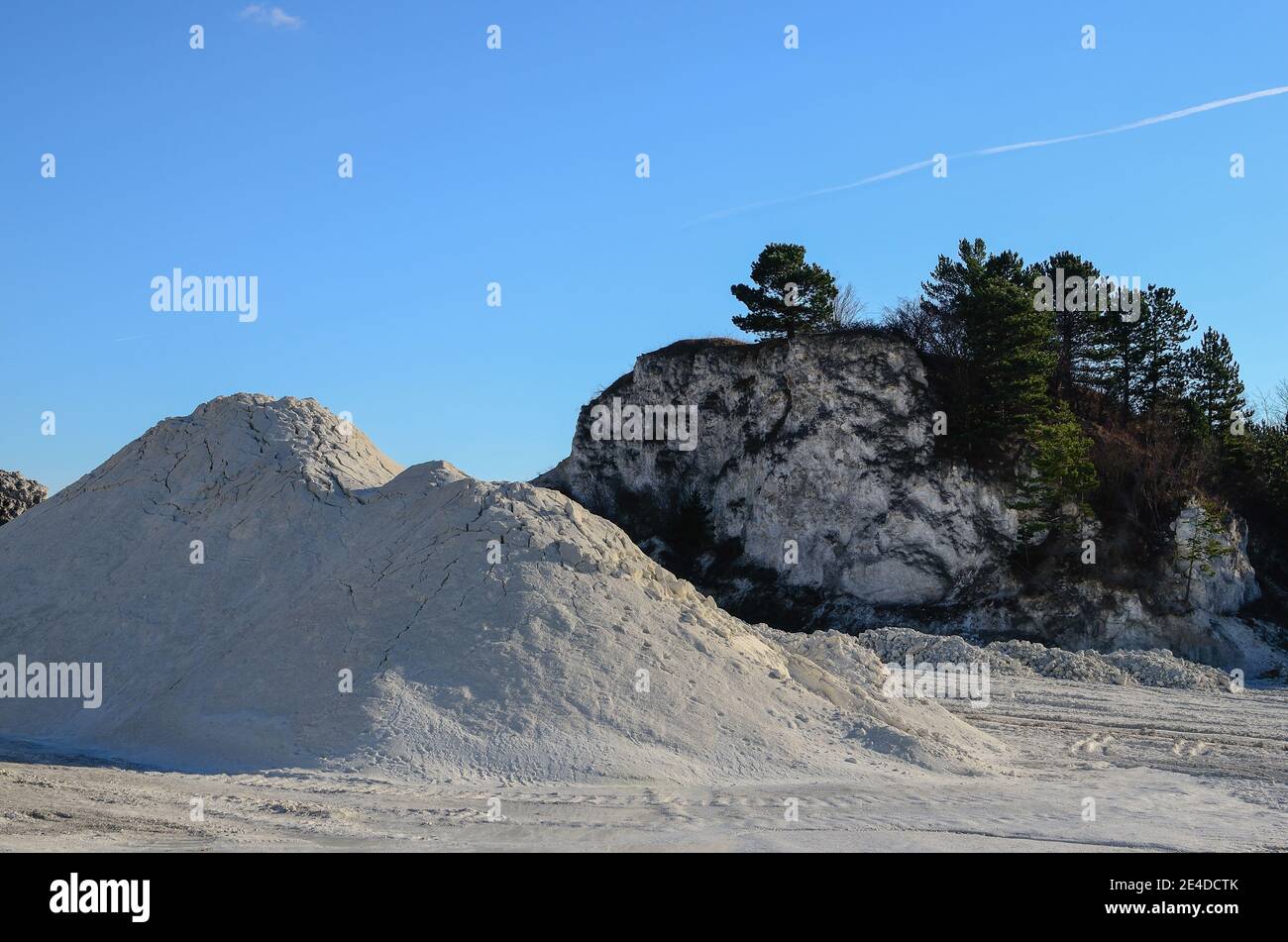 great white chalk quarry and green trees Stock Photo Alamy