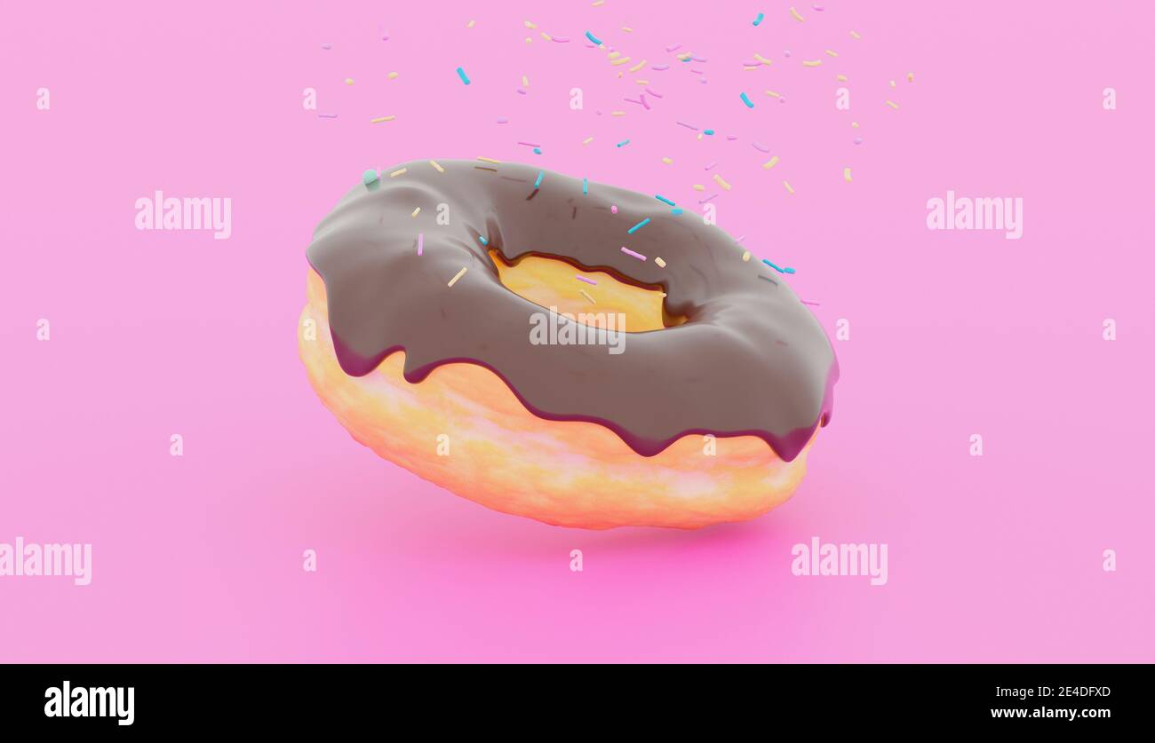 chocolate donut on a pink background with colorful confetti falling on it Stock Photo
