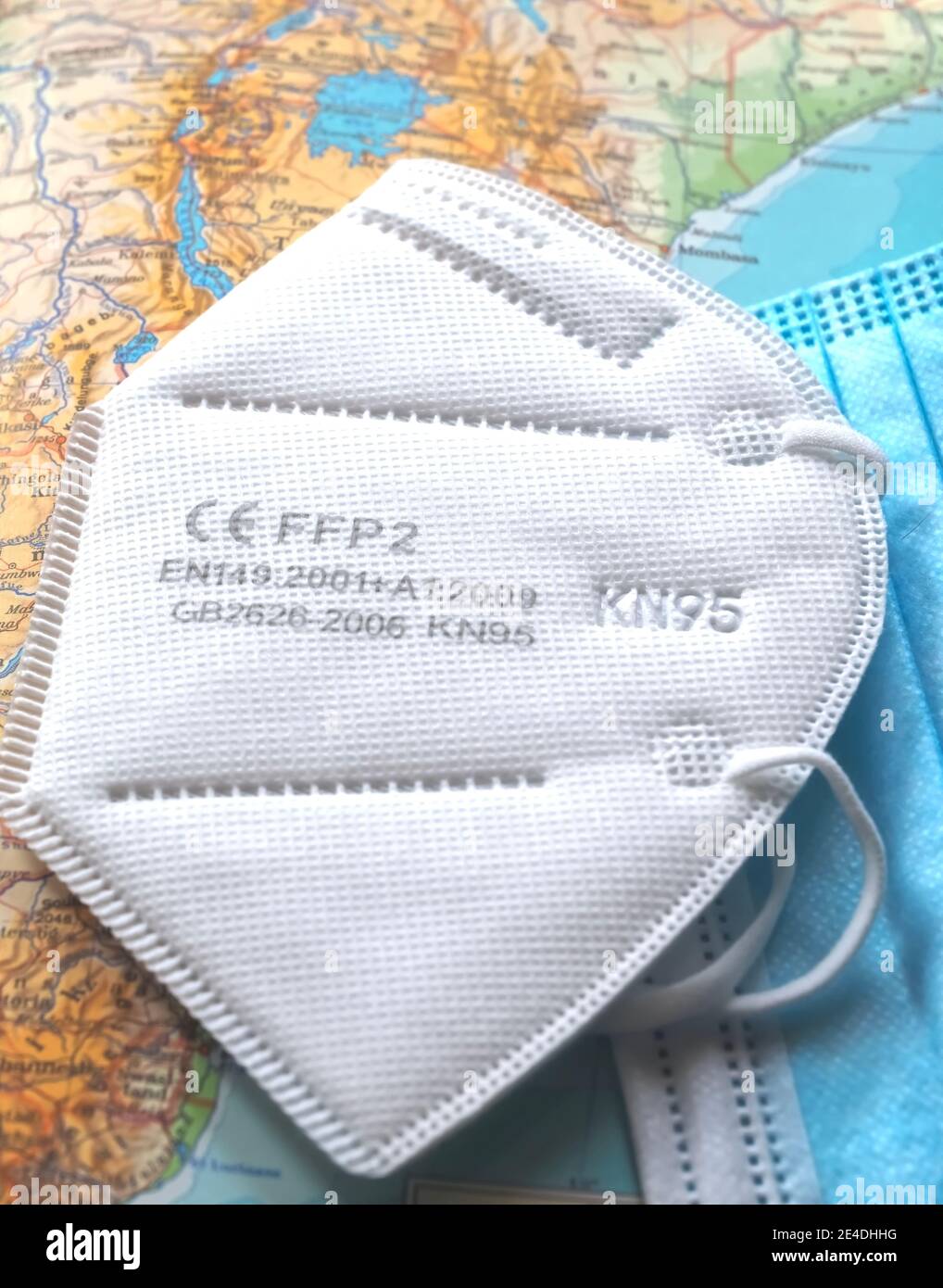 A single FFP2 face mask on a map as a symbol for flight restrictions