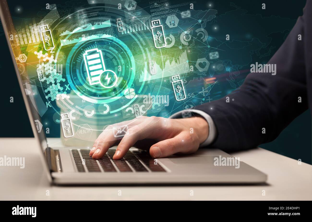 Business hand typing on a modern laptop with battery charging icon ...