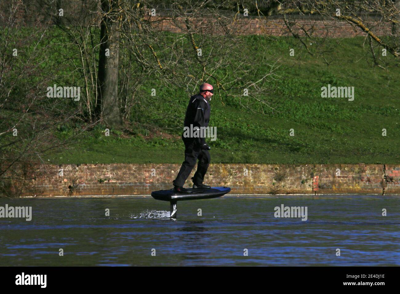 Man riding a personal hydrofoil (Lift eFoil), Sadlers Ride, Hurst Park, East Molesey, Surrey, England, Great Britain, United Kingdom, UK, Europe Stock Photo