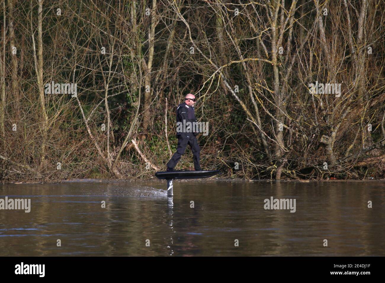 Man riding a personal hydrofoil (Lift eFoil), Sadlers Ride, Hurst Park, East Molesey, Surrey, England, Great Britain, United Kingdom, UK, Europe Stock Photo