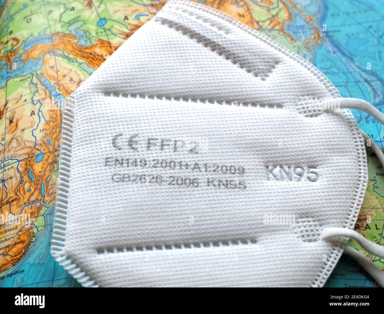 A single FFP2 face mask on a map as a symbol for flight restrictions