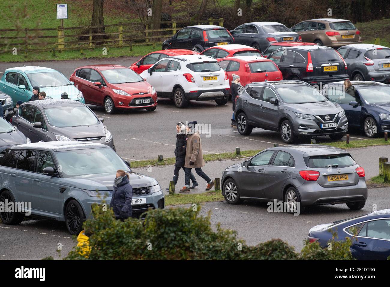 People walk through the car park at Bradgate Park in Leicestershire during England's third national lockdown to curb the spread of coronavirus. Picture date: Saturday January 23, 2021. Stock Photo