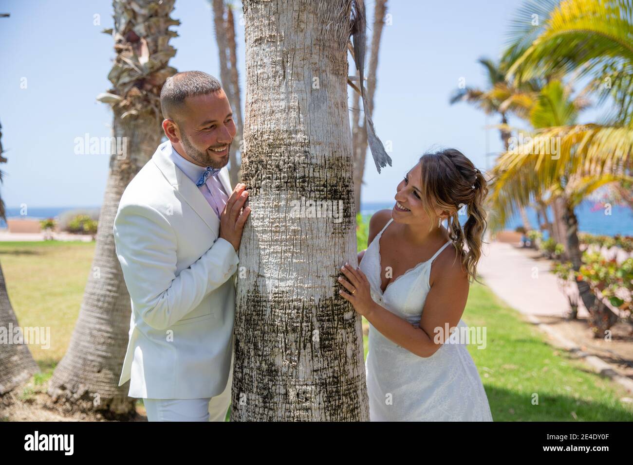 Newly wed couple looks at each other passionately after having celebrated the wedding Stock Photo