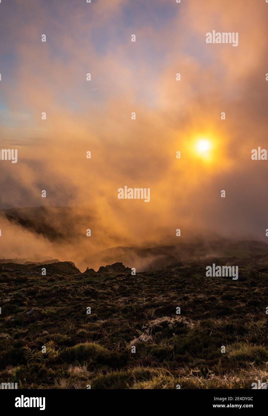Sunset in the clouds, at Pico da Barrosa, Lagoa do Fogo area, Sao