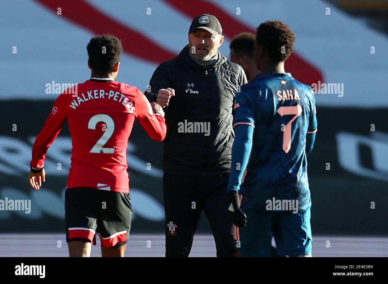 Southampton manager Ralph Hasenhuttl (centre) celebrates with Kyle Walker-Peters (left) after the final whistle during the Emirates FA Cup fourth round match at St. Mary's Stadium, Southampton. Picture date: Saturday January 23, 2021. Stock Photo