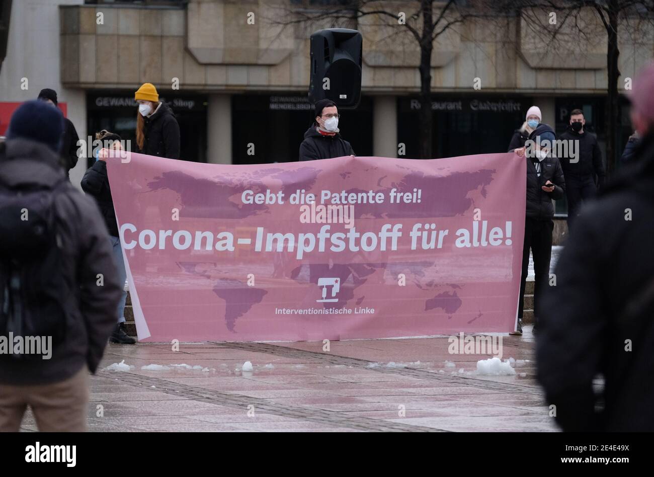 Leipzig, Germany. 23rd Jan, 2021. Participants of a demonstration gather on Augustusplatz. Several hundred people protested for lifting the patent protection for Corona vaccines for poor countries as well as keeping schools closed during the pandemic. Credit: Sebastian Willnow/dpa-Zentralbild/dpa/Alamy Live News Stock Photo