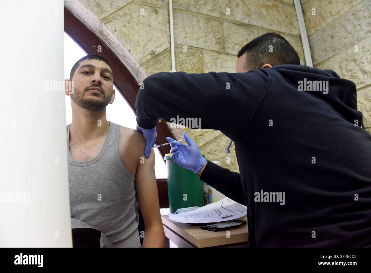 East Jerusalem, Israel. 23rd Jan, 2021. A Palestinian resident of Jerusalem is inoculated with the Pfizer- BioNTech COVID-19 vaccine in the Israeli Clalit Medical Center in East Jerusalem, on Saturday, January 23, 2021. Photo by Debbie Hill/UPI Credit: UPI/Alamy Live News Stock Photo