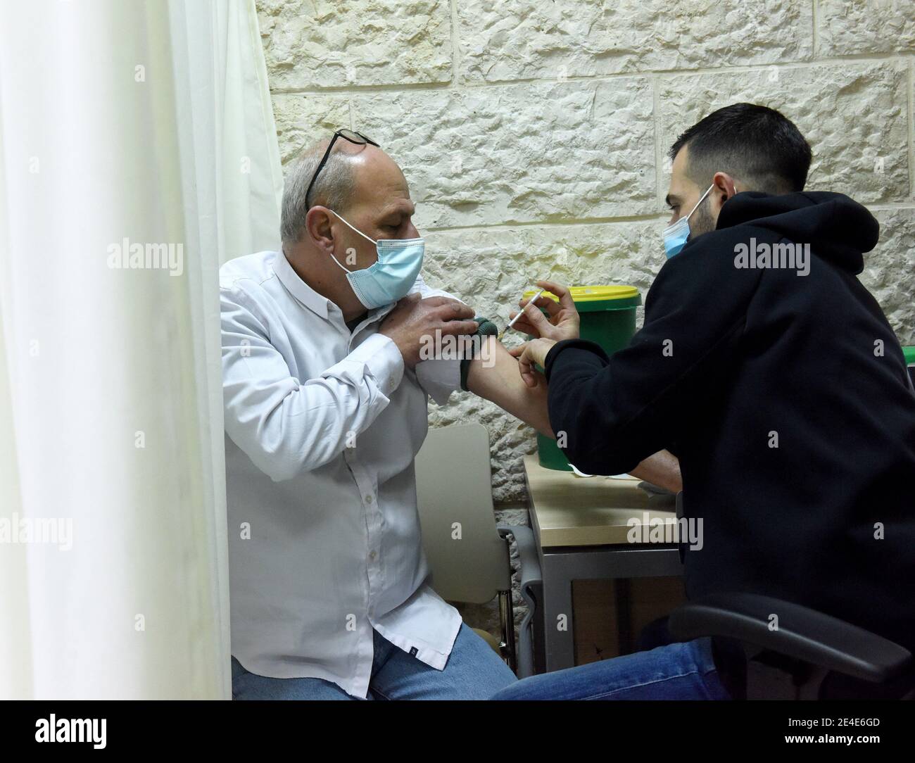 East Jerusalem, Israel. 23rd Jan, 2021. A Palestinian resident of Jerusalem is inoculated with the Pfizer- BioNTech COVID-19 vaccine in the Israeli Clalit Medical Center in East Jerusalem, on Saturday, January 23, 2021. Photo by Debbie Hill/UPI Credit: UPI/Alamy Live News Stock Photo