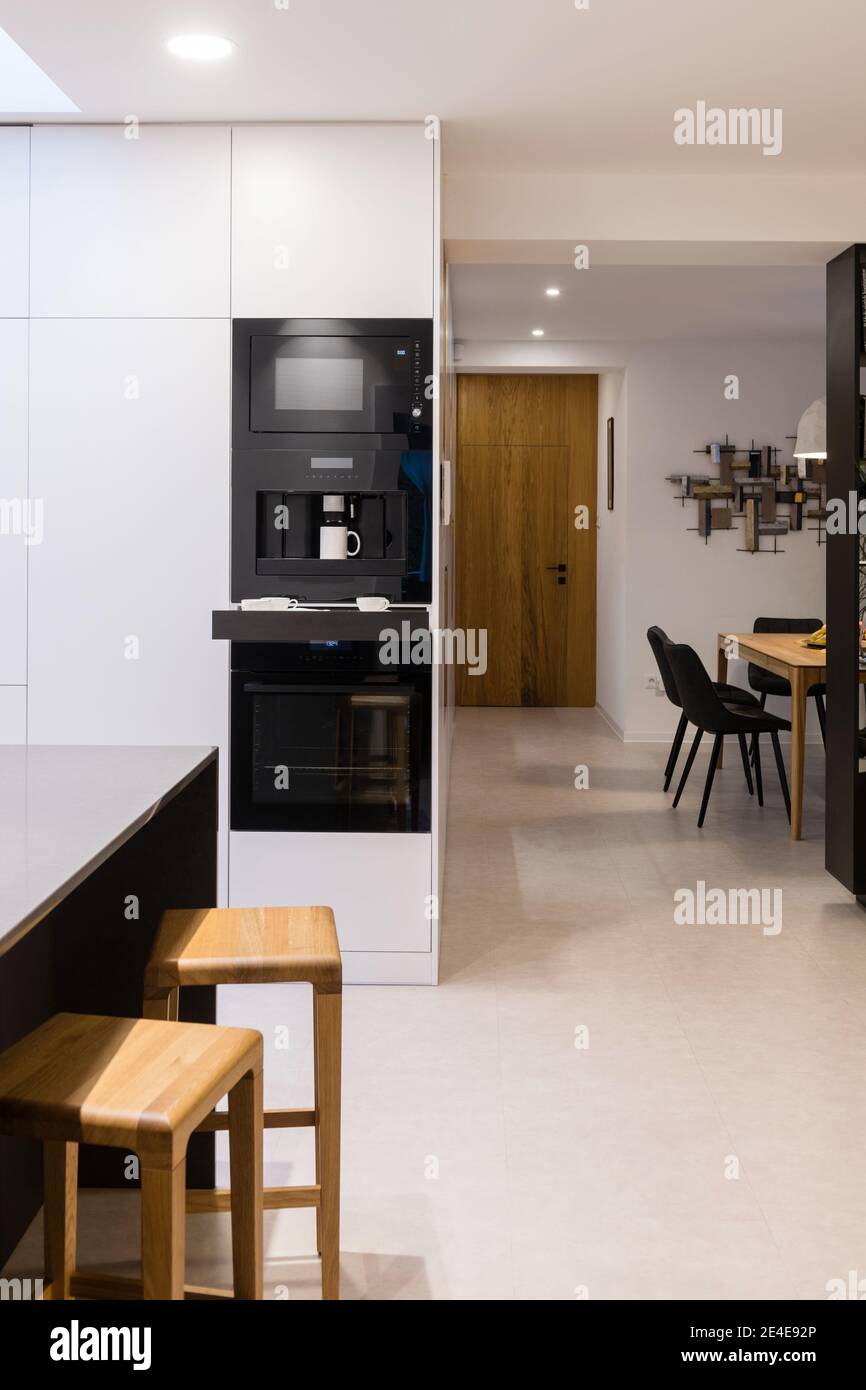 Bar table in kitchen with dining room in background interior of
