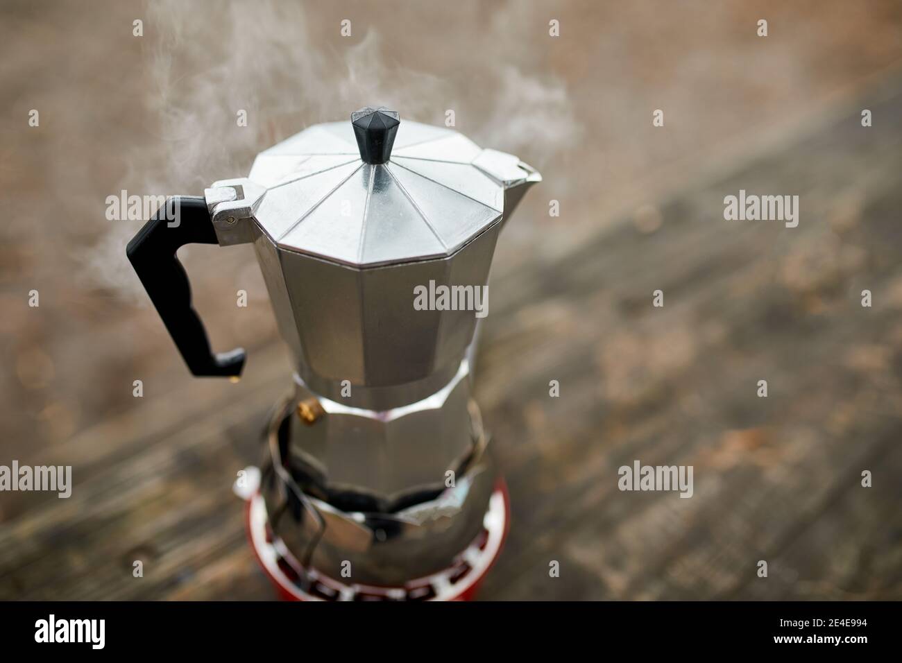 https://c8.alamy.com/comp/2E4E994/process-of-making-camping-coffee-outdoor-with-metal-geyser-coffee-maker-on-a-gas-burner-step-by-step-travel-activity-for-relaxing-bushcraft-advent-2E4E994.jpg