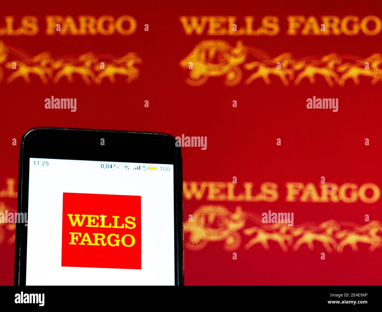 In this photo illustration a Wells Fargo logo seen displayed on smart
