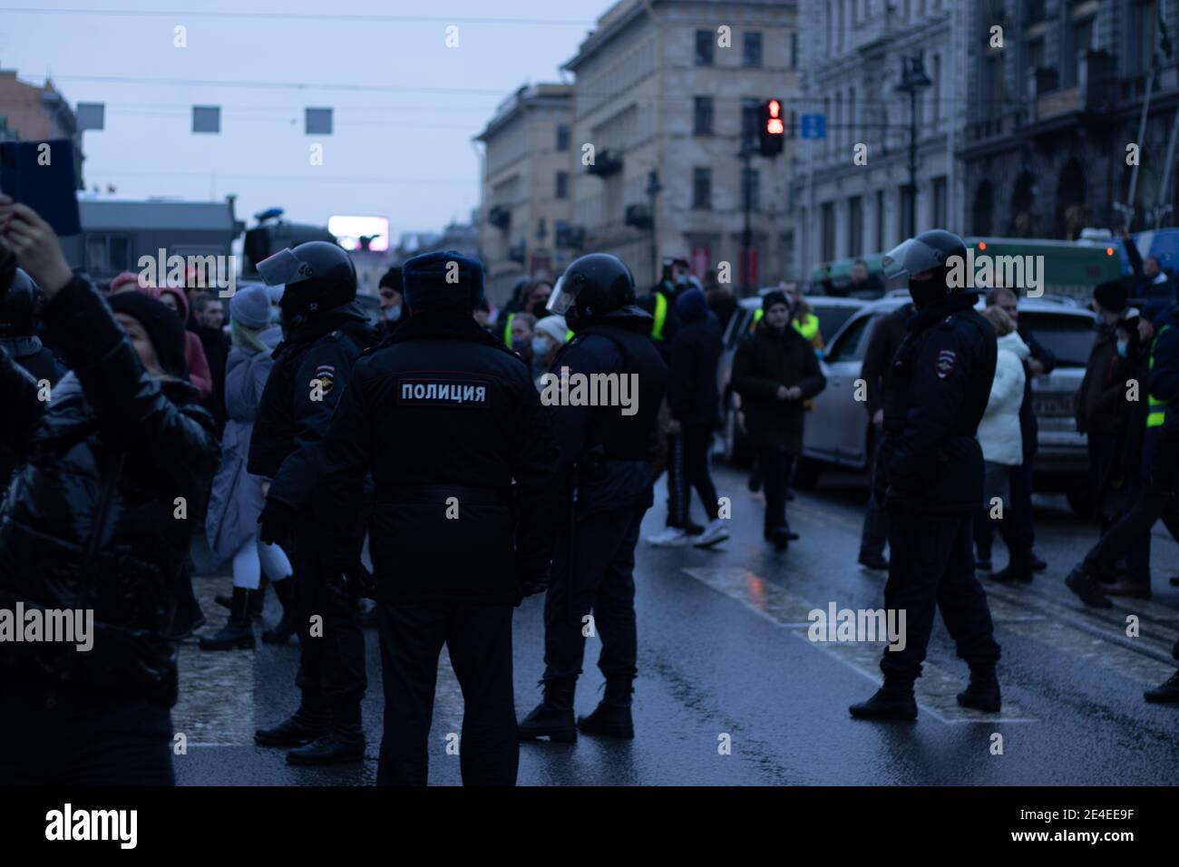 Saint Petersburg, Russia - 23 January 2021: Protest marching in Russia. Police and people on street. Demonstrators crowd , Illustrative Editorial. Stock Photo