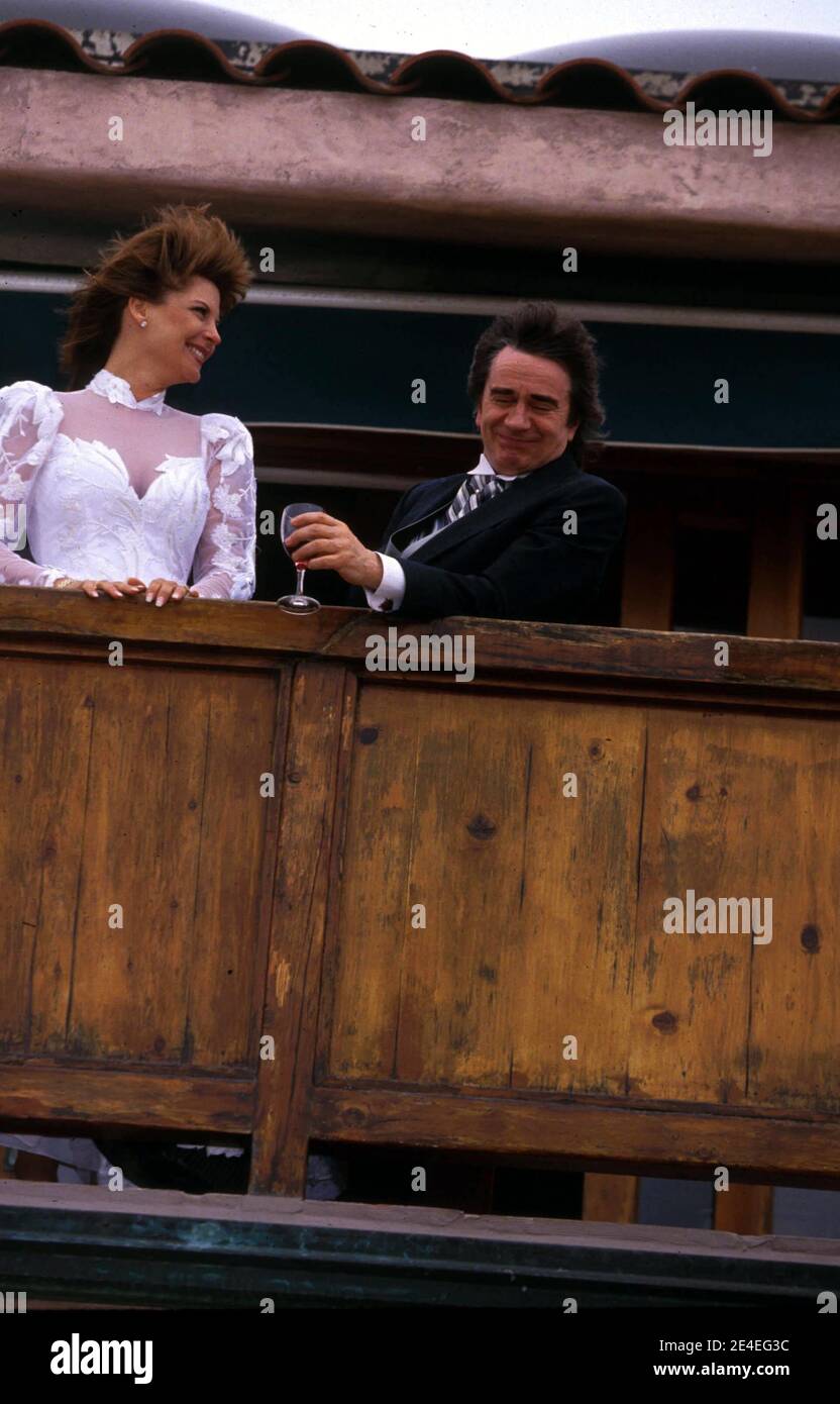 Dudley Moore and Nicole Rothschild stand on the balcony of their home April 16, 1994 in Marina Del Rey, CA Credit: Ralph Dominguez/MediaPunch Stock Photo