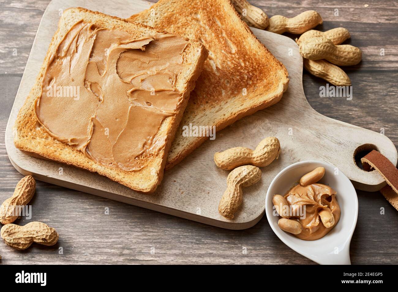 Sweet Breakfast With Peanut Butter Toast On A Wooden Kitchen Board With Fresh Peanuts Stock Photo Alamy