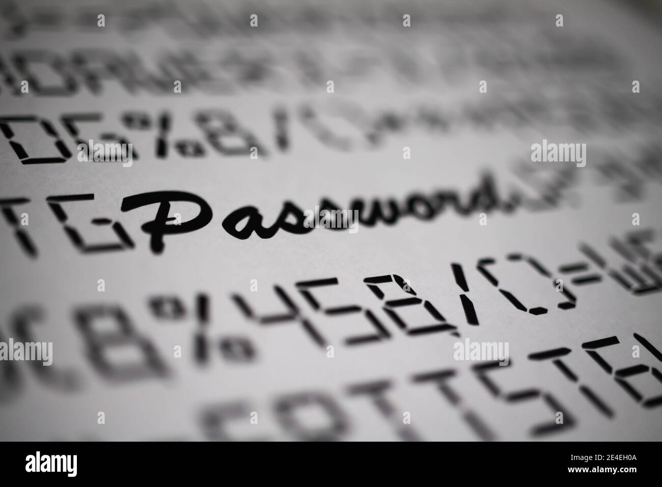 Close up of fictive letters and special characters with blurred word password, white background  - complicated complex password change concept Stock Photo