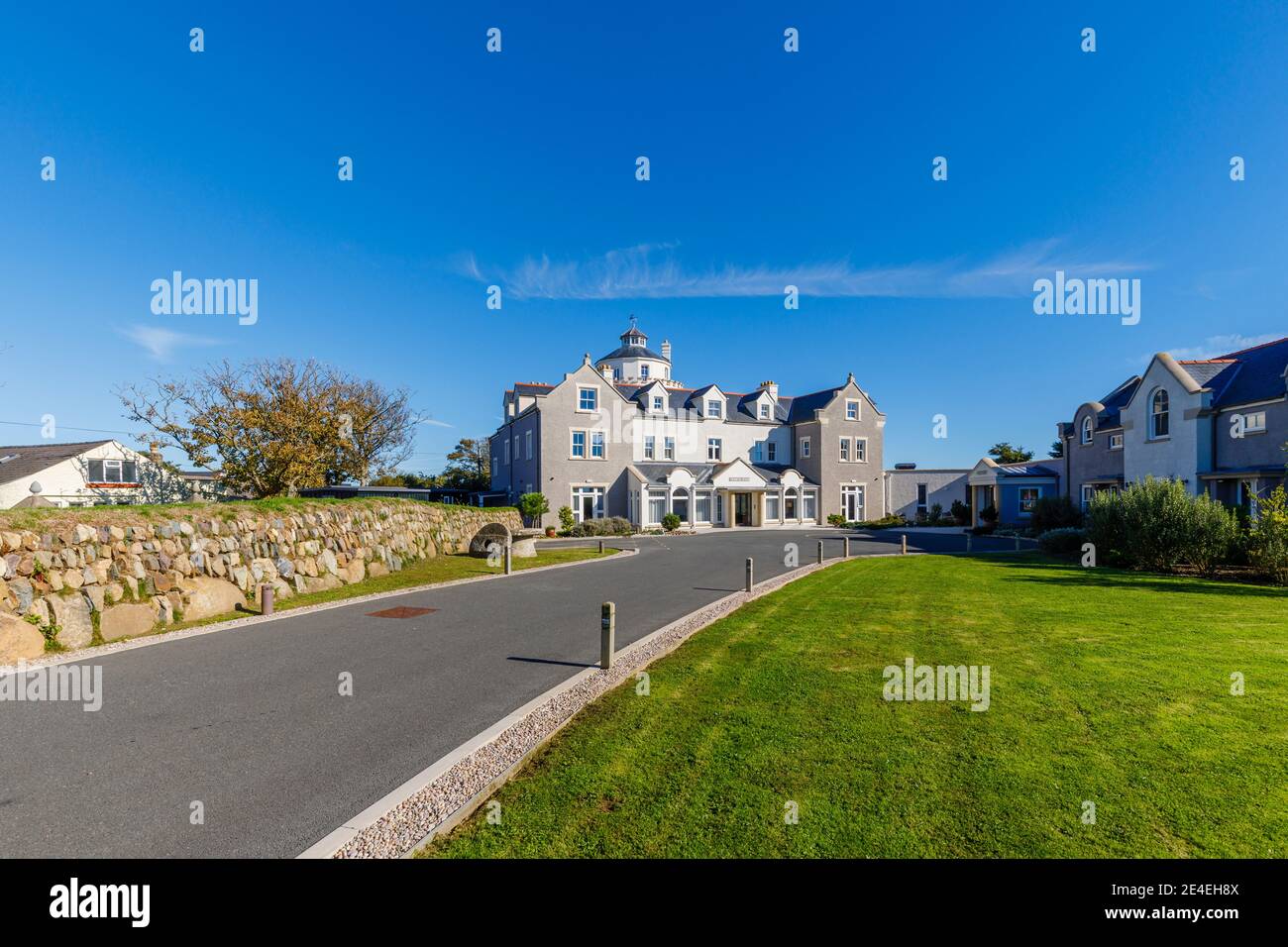 The entrance to and exterior of Twr y Felin Hotel and restaurant in St Davids, a small cathedral city in Pembrokeshire, southwest Wales on a sunny day Stock Photo