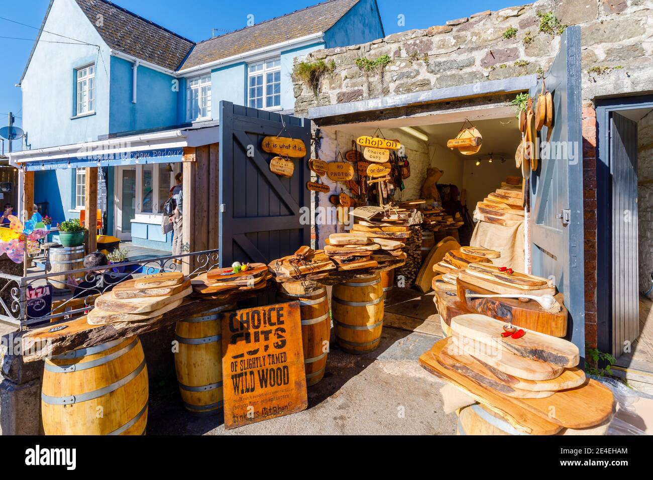 A local wood carver's shop selling tourist souvenirs in the main street of St David's, a small cathedral city in Pembrokeshire, south west Wales Stock Photo