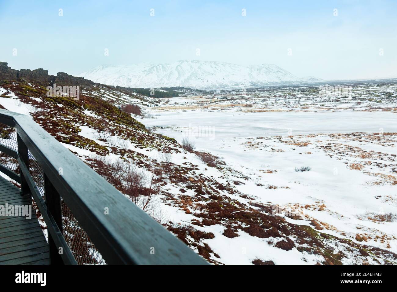 Thingvellir National Park, Iceland on a cold, wintry day, with coaches and transport at the end of the walkway. Stock Photo