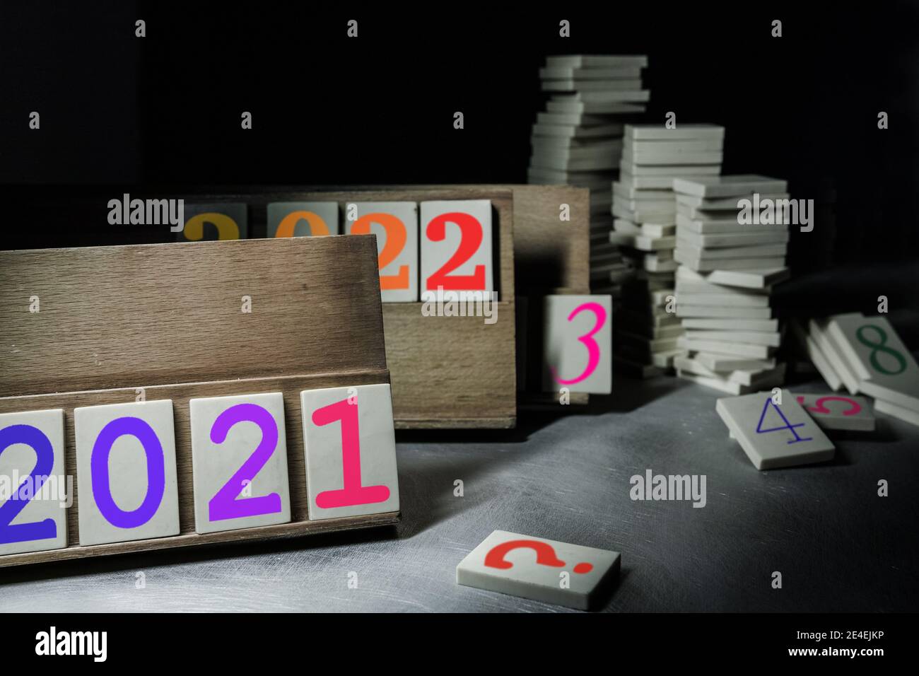 Based on a rummikub game, on the racks we see the years 2021, 2022