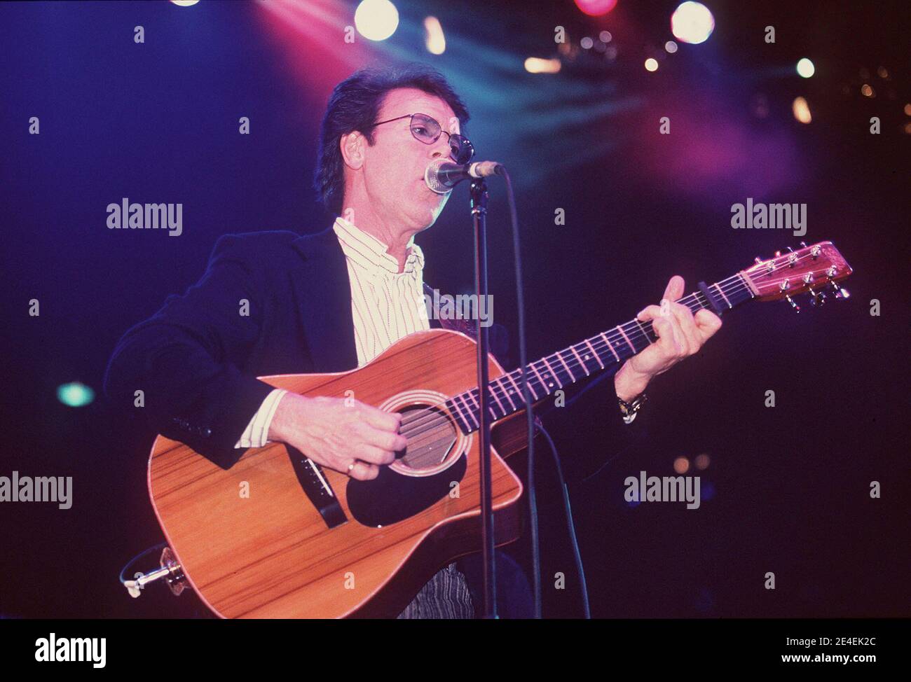 Sir Cliff Richard Performing at the 'Children In Crisis' Concert held at the London Docklands Arena, London, UK. 10th December 1997 Stock Photo