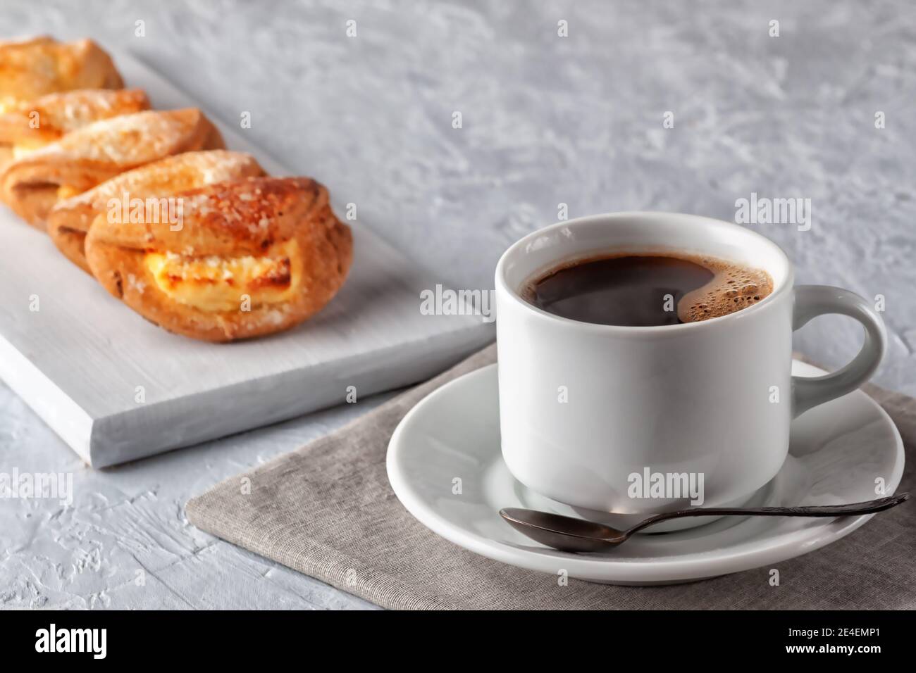 Homemade cakes, cup of coffee and homemade cookies with cottage cheese on gray background Stock Photo