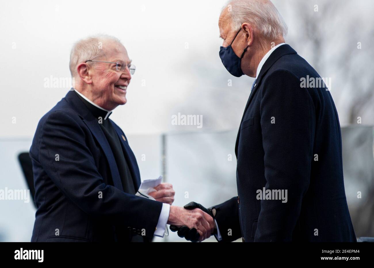 Washington, United States Of America. 20th Jan, 2021. Roman Catholic priest Father Leo J. O'Donovan congratulates President-elect Joe Biden after the invocation prayer during the 59th Presidential Inauguration ceremony at the West Front of the U.S. Capitol January 20, 2021 in Washington, DC Credit: Planetpix/Alamy Live News Stock Photo
