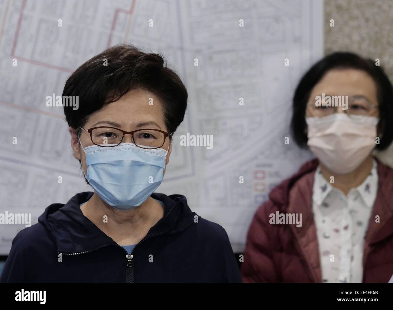Hong Kong, China. 23rd Jan, 2021. Chief Executive of the Hong Kong Special Administrative Region Carrie Lam (L) speaks during an interview after her inspection tour in a virus-stricken area in Kowloon, Hong Kong, south China, Jan. 23, 2021. TO GO WITH 'Roundup: A year after 1st case found, Hong Kong's COVID-19 tally surpasses 10,000' Credit: Wang Shen/Xinhua/Alamy Live News Stock Photo