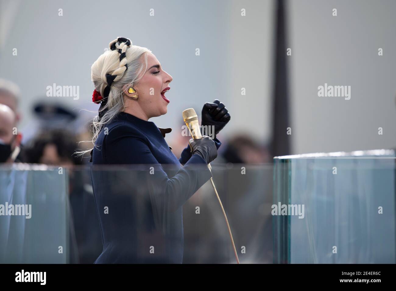 Washington, United States Of America. 20th Jan, 2021. Musical superstar Lady Gaga sings a rendition of The Star-Spangled Banner during the 59th Presidential Inauguration ceremony at the West Front of the U.S. Capitol January 20, 2021 in Washington, DC Credit: Planetpix/Alamy Live News Stock Photo