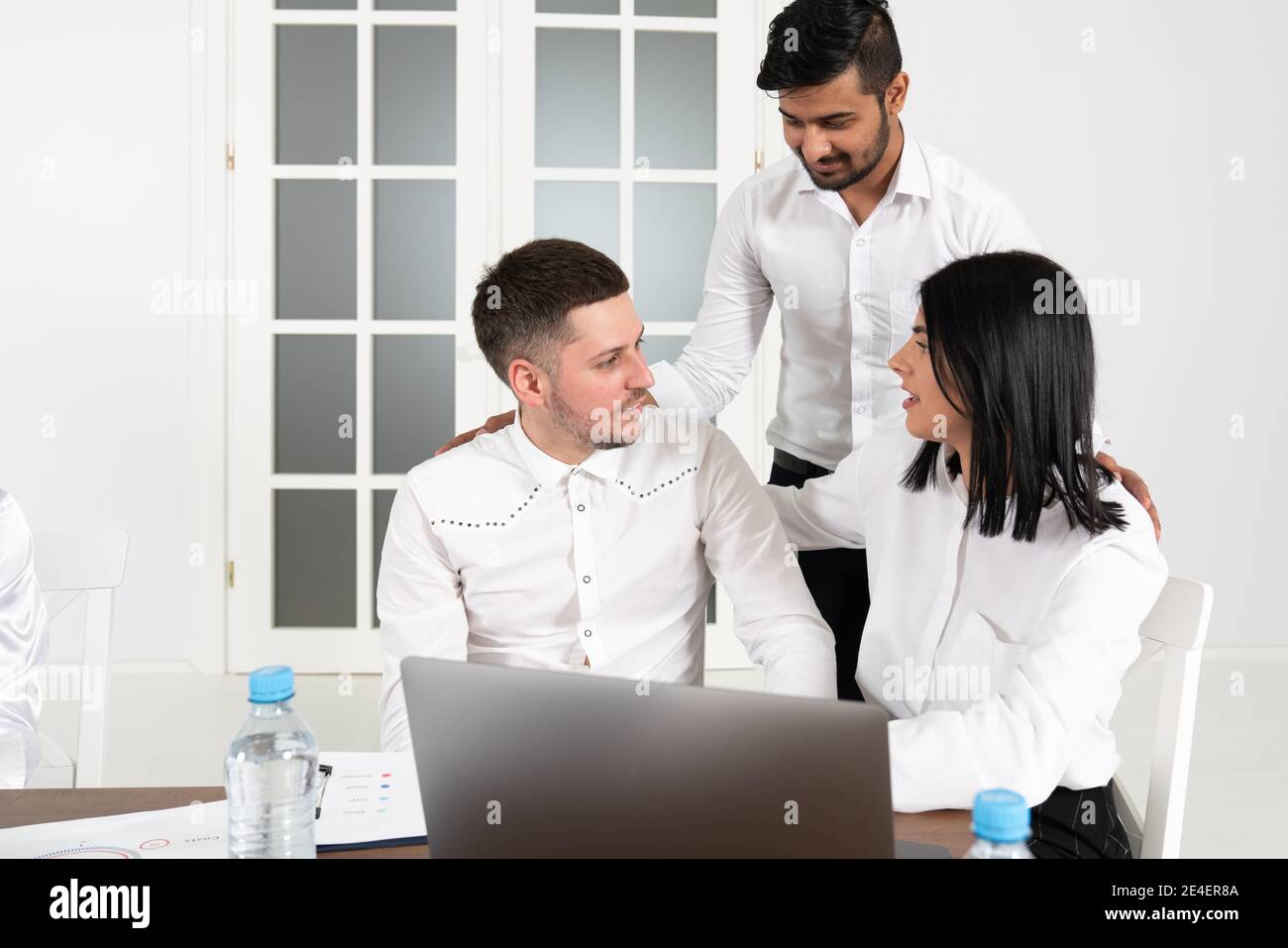 Group of international business people and software developers working as a team in modern office Stock Photo