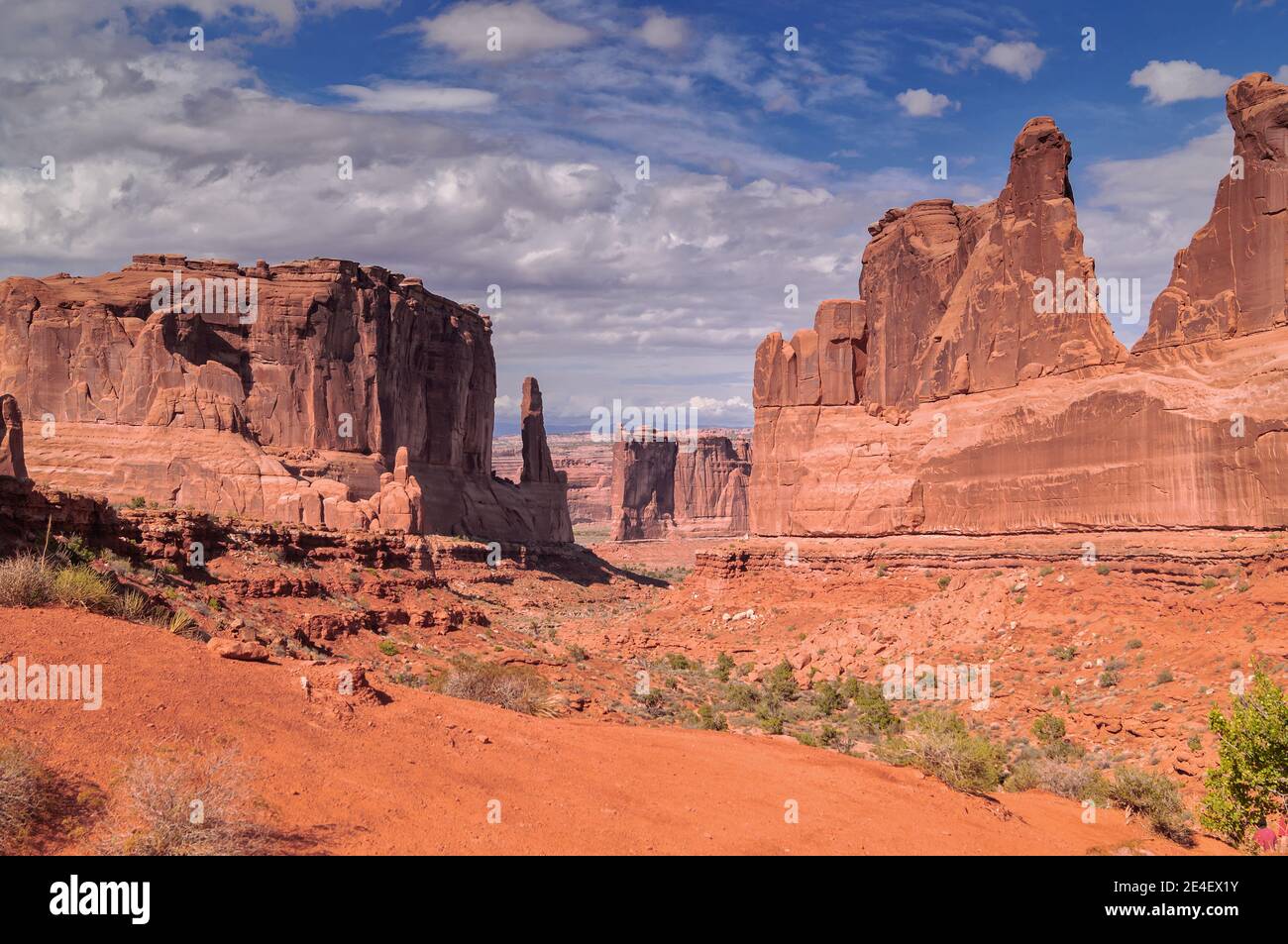 A scenic view on the Park Avenue trail in Arches National park against blue sky. Stock Photo