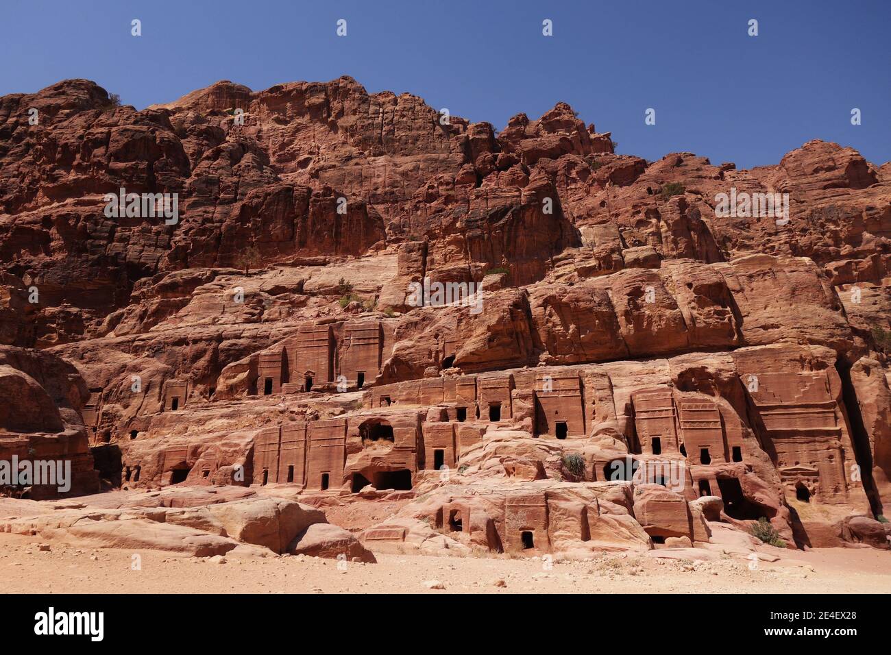 Streets of Petra with multiple carved buildings Stock Photo
