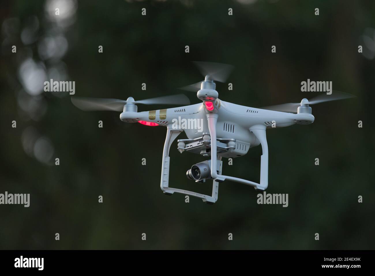 18 - Side view of professional camera drone for videography. 4 sets of propellers as its a quadcopter, controlled by radio link and also by FPV video Stock Photo