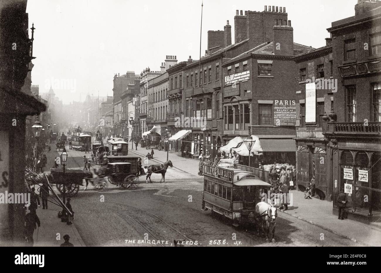 Vintage 19th century photograph: Briggate, street in Leeds, horse drawn trams, hackney carriages. Stock Photo