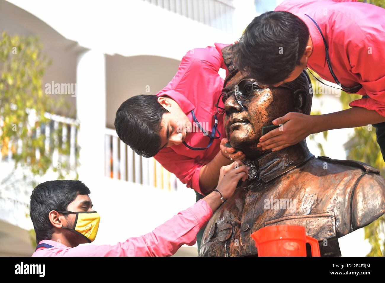 The school students of Netaji Subhas Vidyaniketan washed and cleaned the statue of Netaji Subhash on the eve of the birth anniversary of Indian nationalist, Netaji Subhas Chandra Bose. Netaji Subash Chandra Bose's birthday on January 23rd will be celebrated as Parakarm Diwas. Bose was a prominent Indian nationalist leader who attempted to gain India's independence from British rule by force during the waning years of World War II. Agartala, Tripura, India. Stock Photo