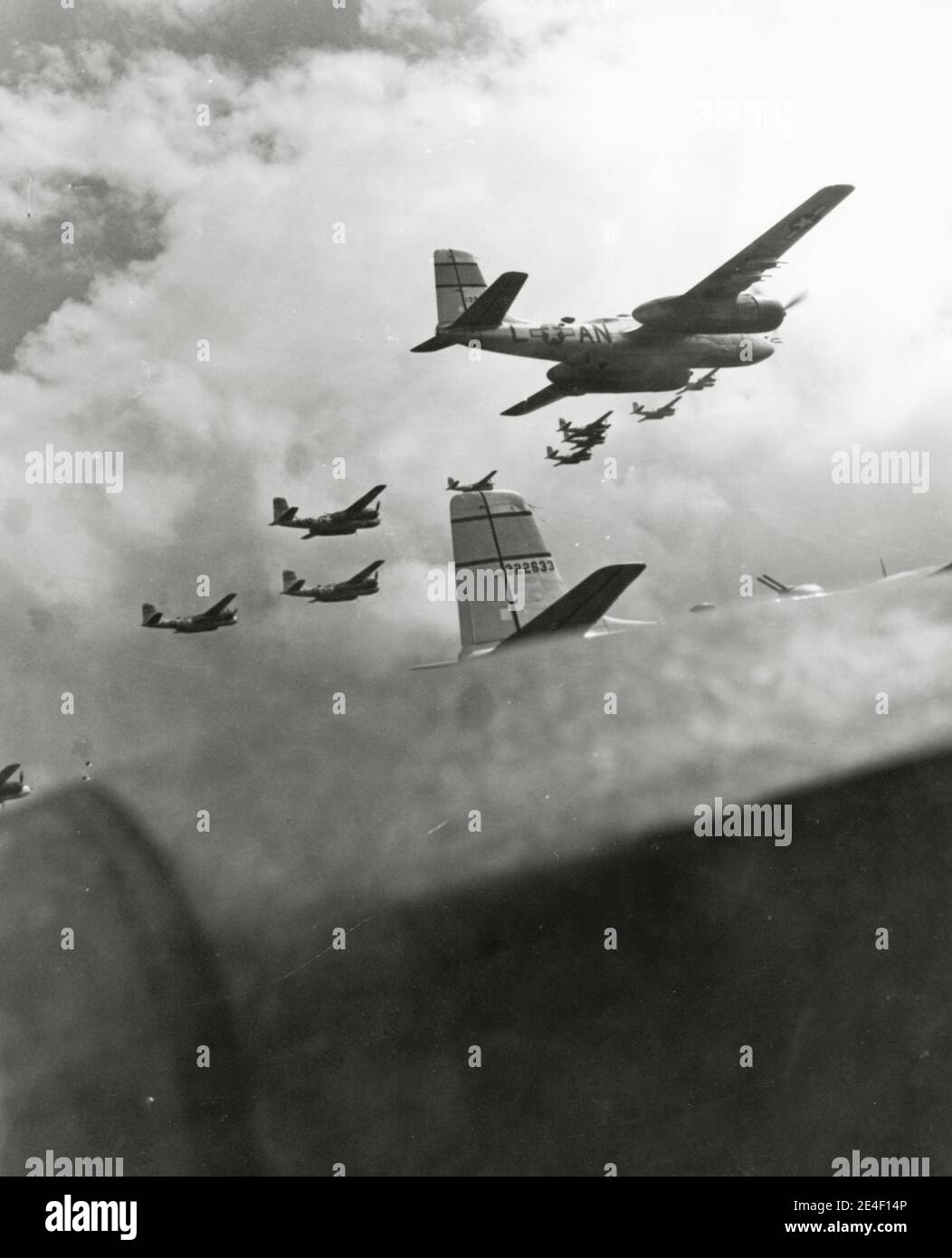 Vintage World War II photograph - official US military photo: silhouette of a flight of Douglas A-26 Invader aircraft of the allied 386th Bomb Group, over Germany April 1945.. Stock Photo