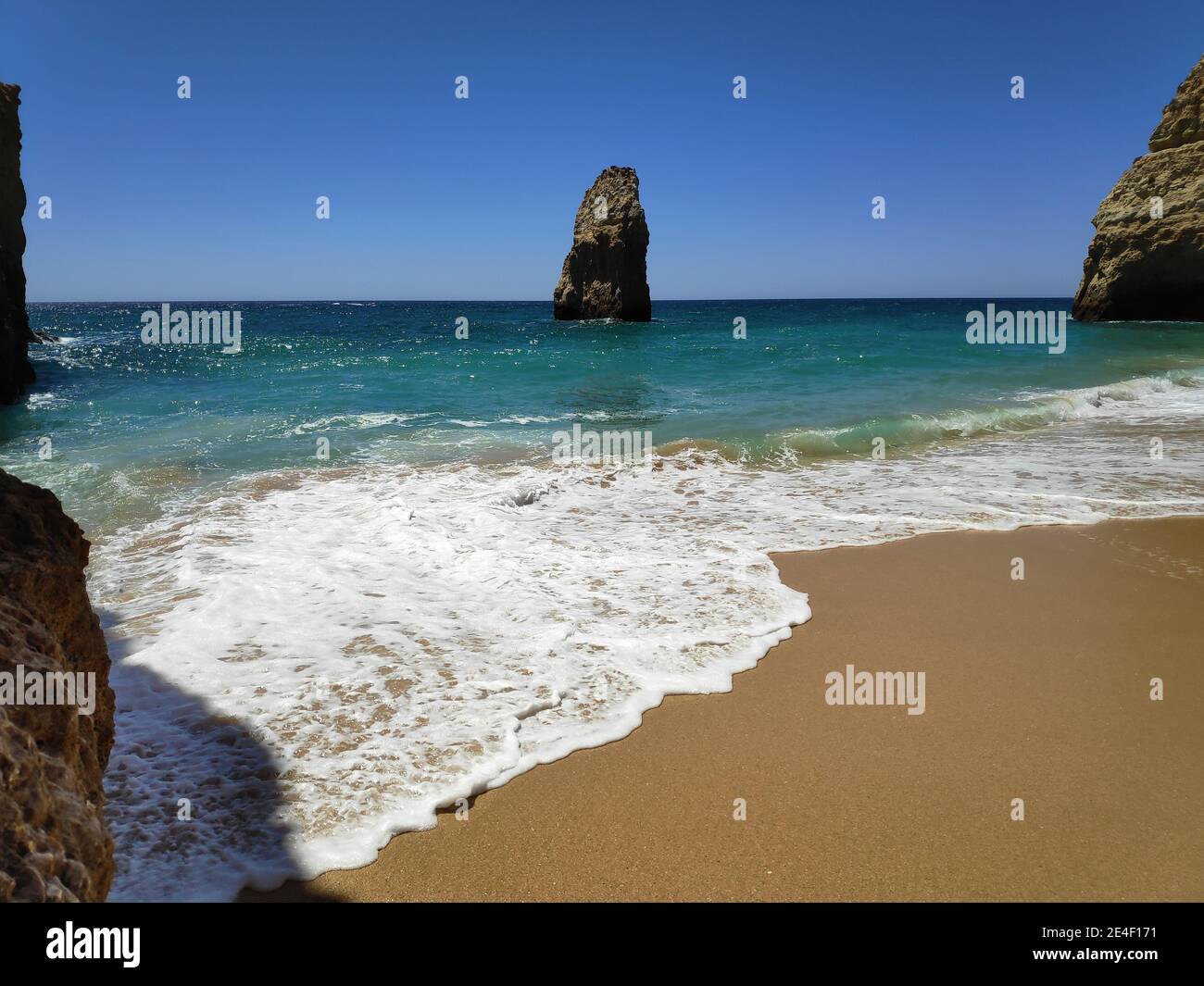 Amazing shot of the waves splashing on a sandy beach - perfect for ...
