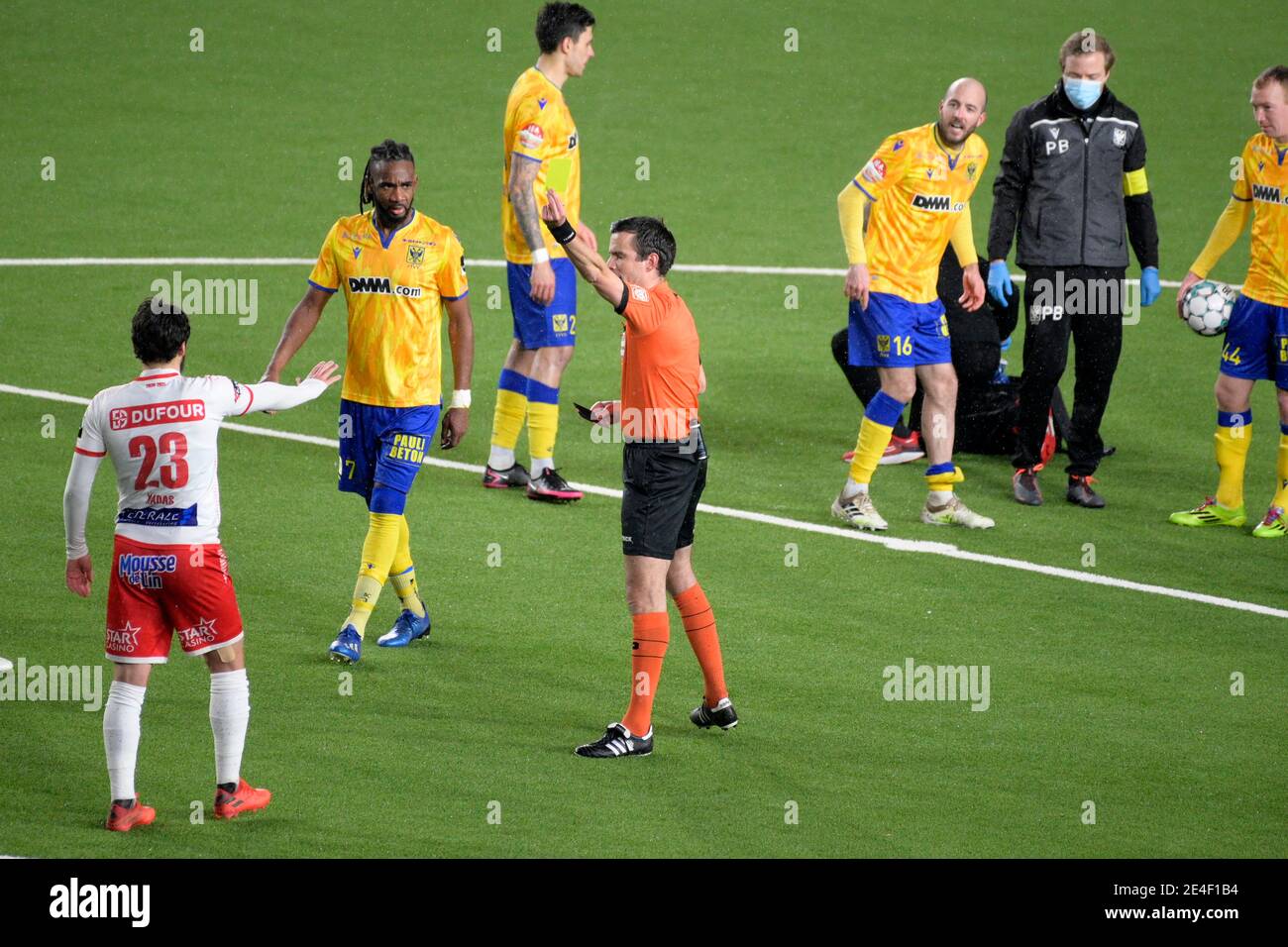 Mouscron's Bruno Xadas Alexandre Vieira Almeida receives a yellow card from referee Erik Lambrechts during a soccer match between STVV Sint-Truiden an Stock Photo