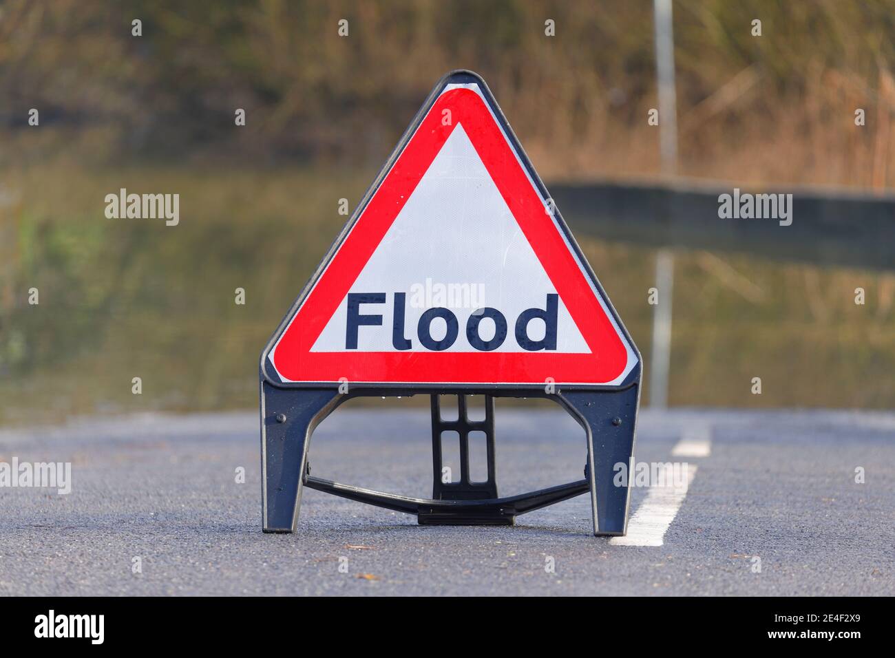A flood warning sign on Ledston Mill Lane in West Yorkshire after Storm Christoph brough flooding to the area. Stock Photo
