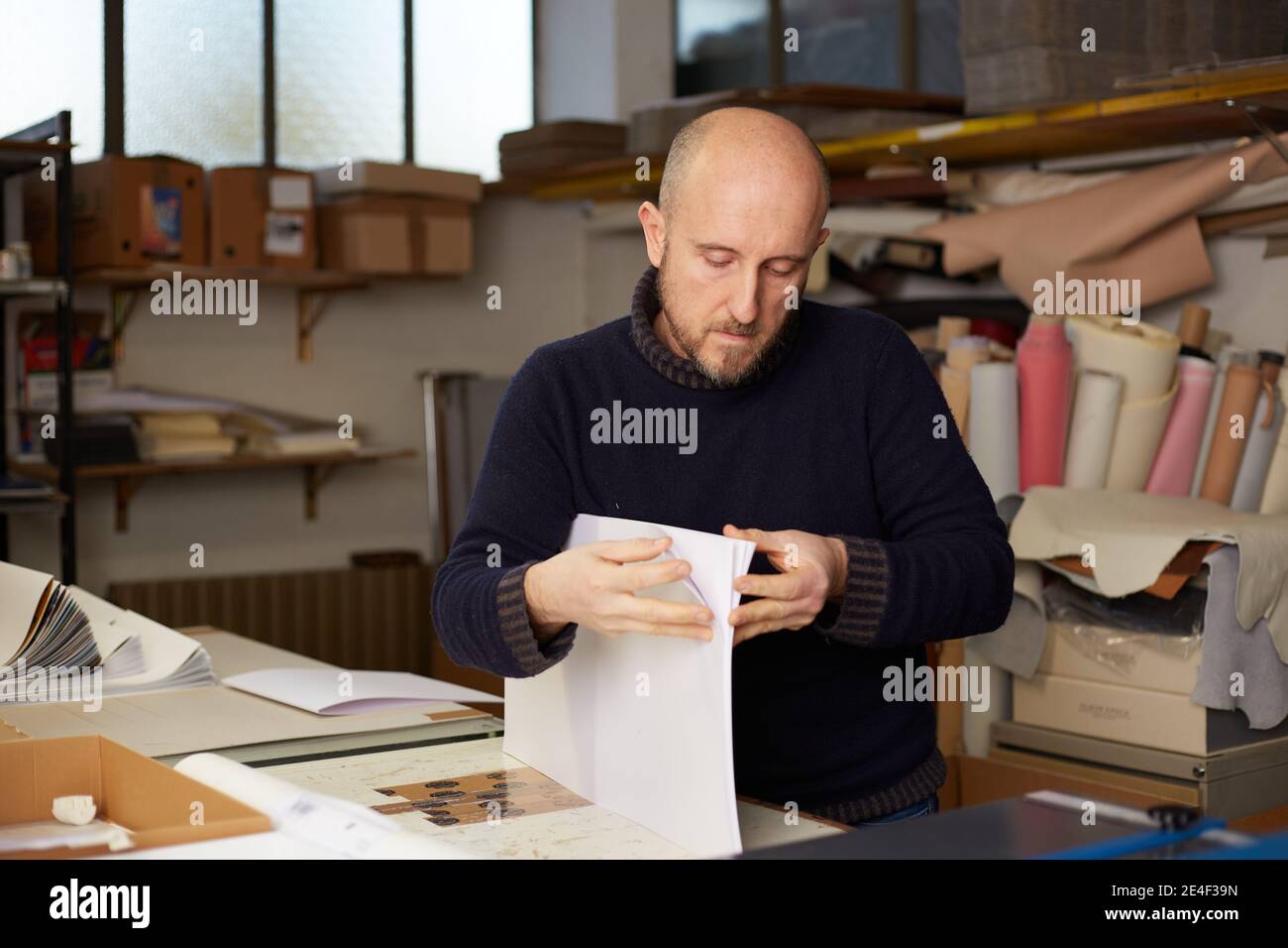 book binder working in a warehouse Stock Photo Alamy