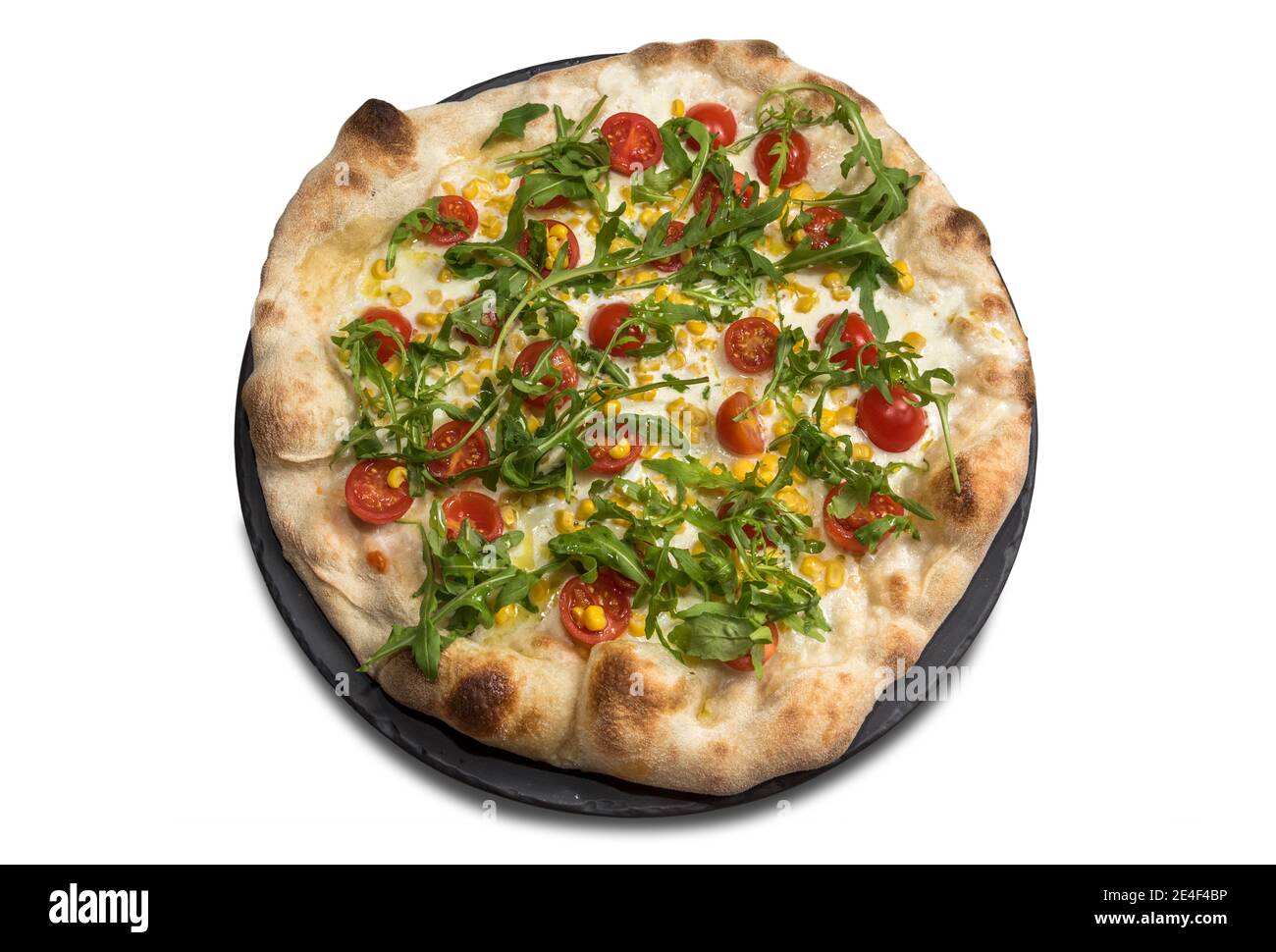 Pizza with mozzarella, chopped cherry tomatoes, corn and arugula salad isolated on white background. Top view, flat lay Stock Photo