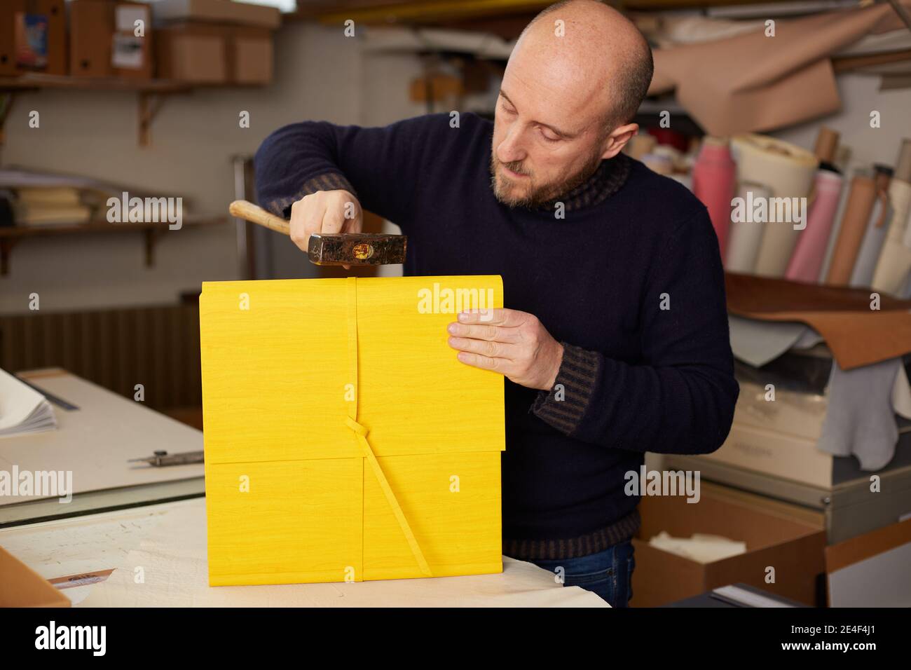 book binder working in a warehouse Stock Photo Alamy