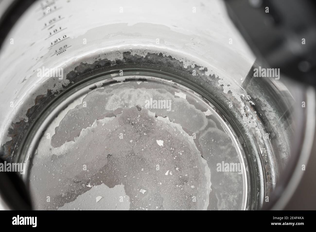 Limescale at the bottom of kettle hard water and calcium concept