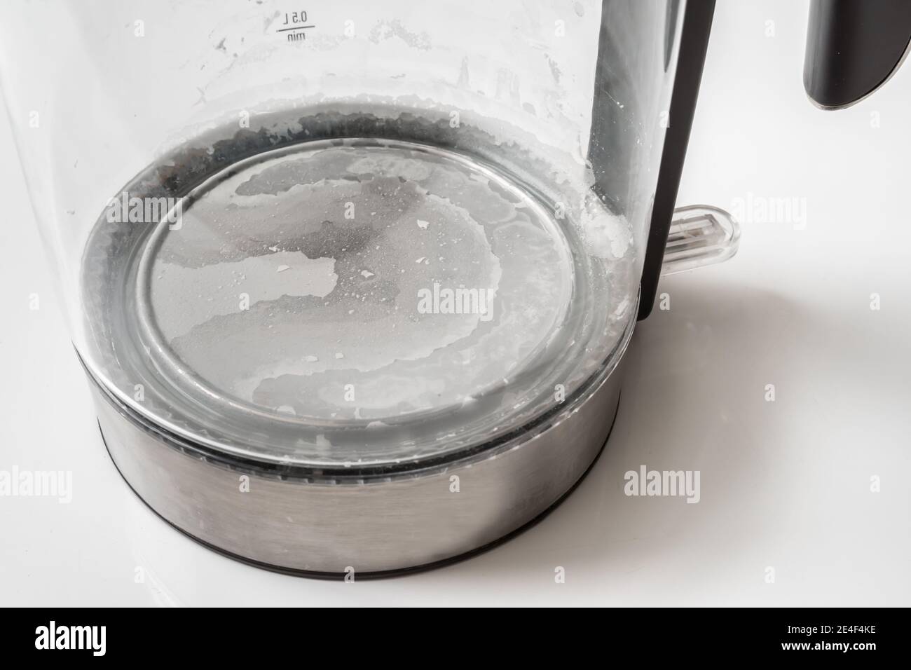 Limescale at the bottom of kettle hard water and calcium concept