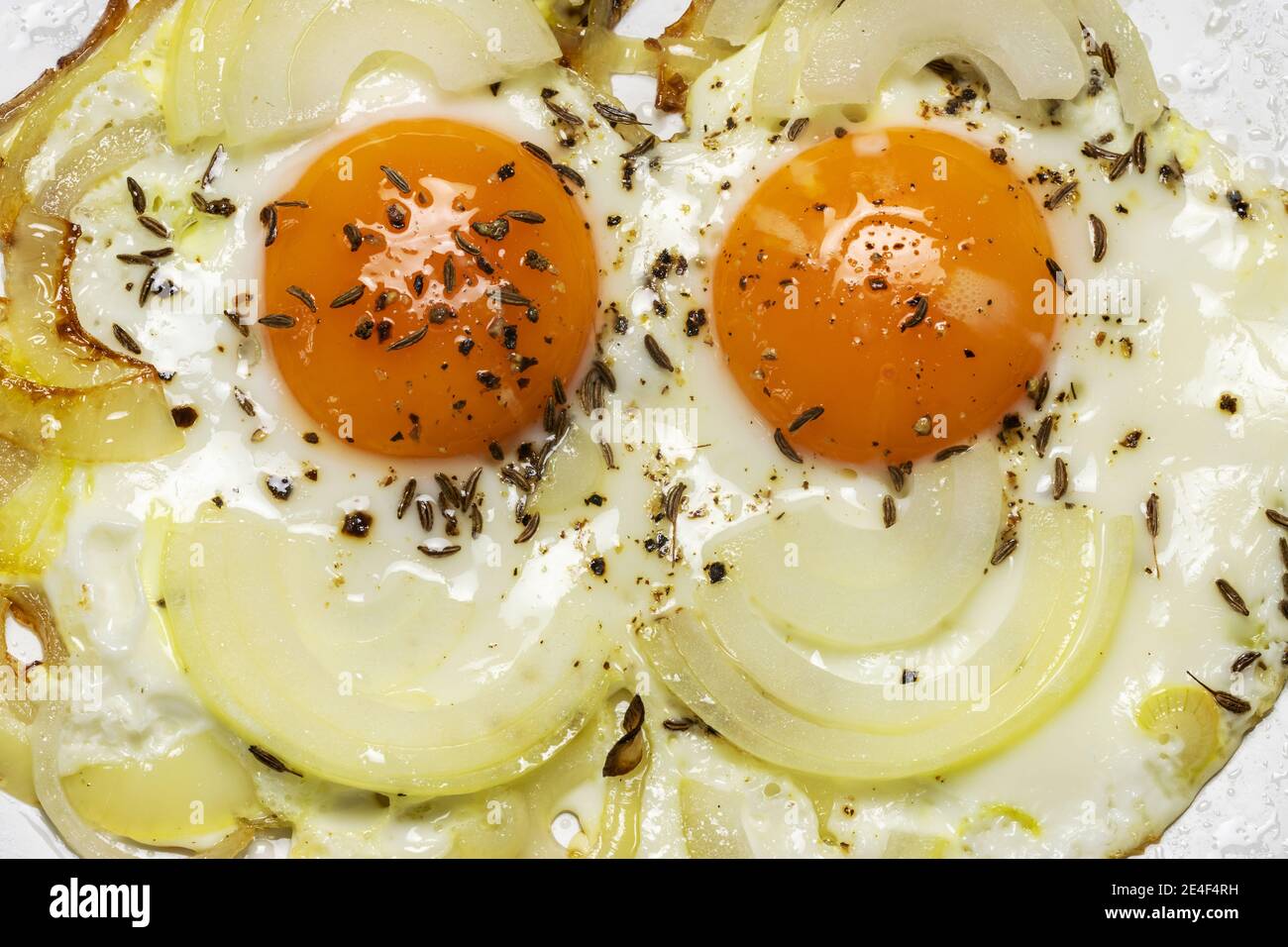 Two fried eggs (shaped as a face) Stock Photo