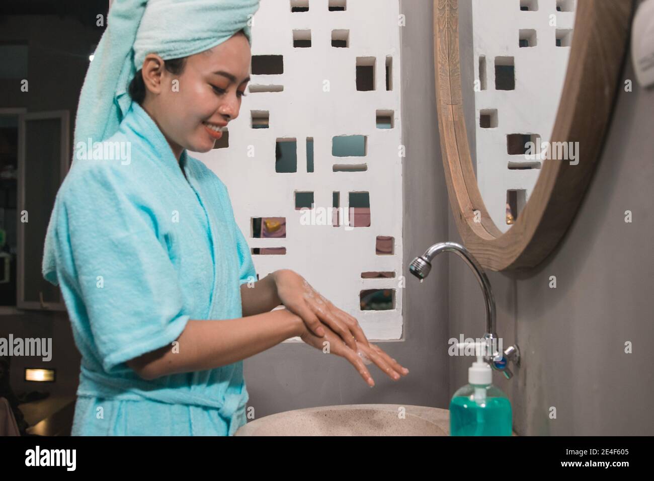 Asian girls use bath towels wash their hands with soap until foamy in