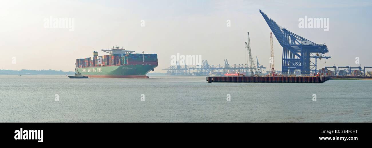 China Shippings Container vessel CSCL Atlantic Ocean pulling away from Felixstowe port tugs helping. Stock Photo