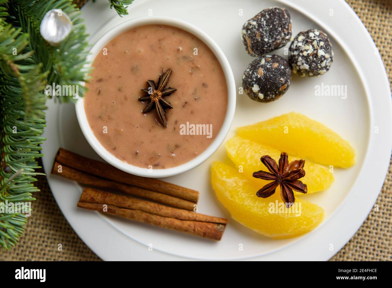 Plum pudding with a hint of orange with spicy date truffles, xlose-up Stock Photo